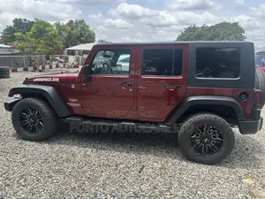 Jeep Wrangler Unlimited Sahara 2011 Burgundy