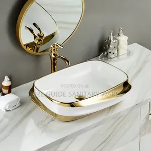 White and Gold Ceramic Counter Top Basin