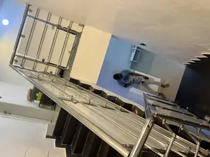 Stainless Handrail Protected With Boards