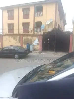 A Gated Land With Old Structure Along Isheri Road Magodo