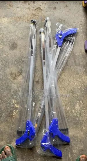 Several Litter Pickers / Grabber Or Reaching Assist Tools.