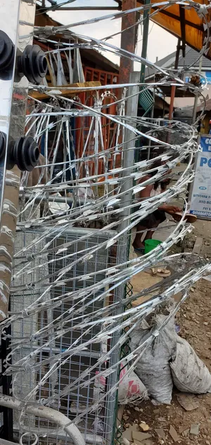 Razor Wire Or Concertina Wire.