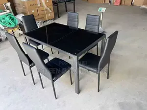A Set of Dinning Table With 6 Chairs