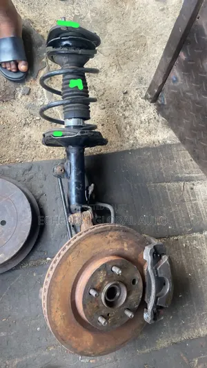 This Toyota Camry 2010 Front Shock With Disc and Hub With Caniper.
