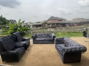 A Standard Sofa With Royal Chairs