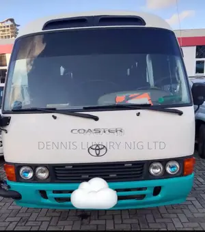 Toyota Coaster Minibus White/Turquoise for Hire With Driver