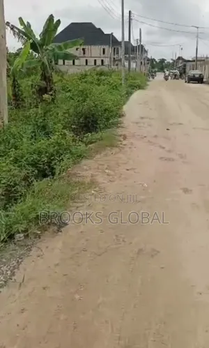 A Land of 100/100 on Tiled Road at Nigercat Warri for Sale