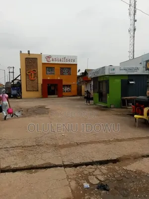 Tantalizers at College Ikotun for Sale On1300 Square Meter With C of O