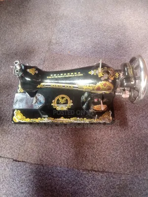 Sewing Machine Together With Leg