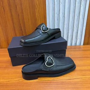 Martine Rose Men's Square Toe Buckle Mule.
Available in Two Colors.