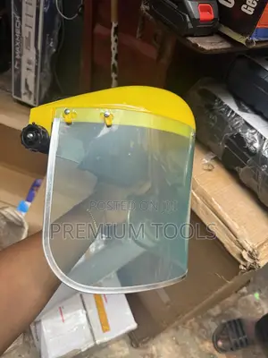 Re-usable Safety Face Shield With A Yellow Headgear.