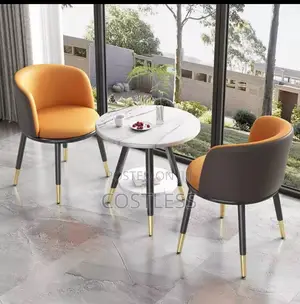 Modern Dining Set Featuring a Round Faux Marble Table