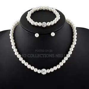 Pearl Jewelry Set With Crystal Accents–Necklace, Bracelet and Earrings