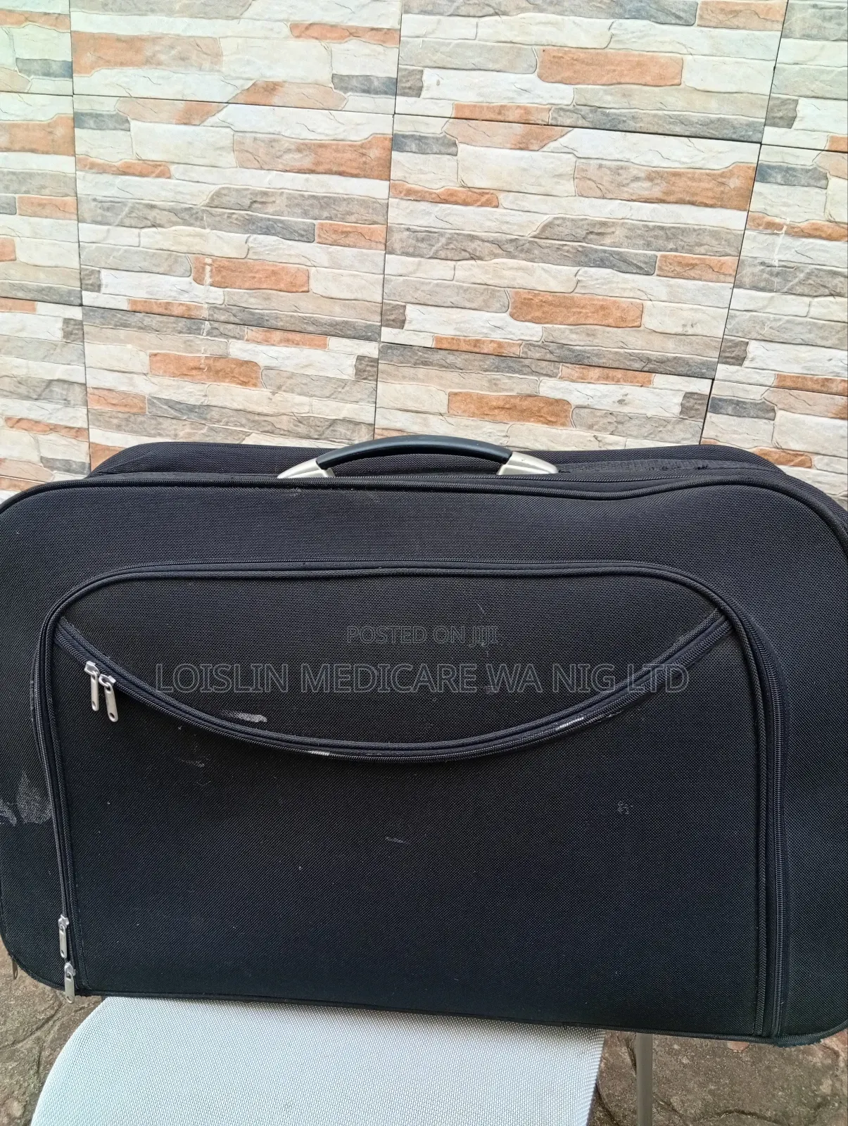 Spacious Black Rolling Travel Bag With Wheels
