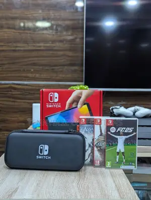 Uk-Used Open-Box Nintendo Switch Oled — Fc25 + Two Disc Games.