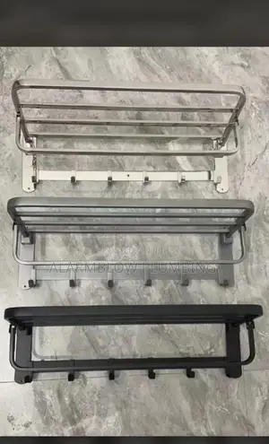 Wall-Mounted, Foldable Towel Racks in Silver, Grey, and Black.
