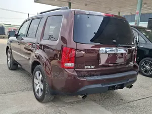 Honda Pilot Touring w/RES/Navi 4WD (3.5L 6cyl 5A) 2013 Burgundy
