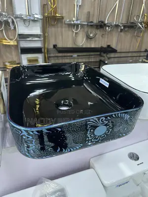 Black Ceramic Vessel Washbasin With a Blue Paisley or Damask Pattern.