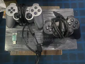 Ps 2 With 2 Pads and 5 Games