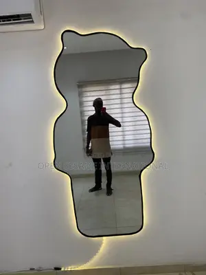 A Teddy Bear Shaped Mirror With Lights