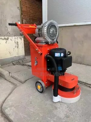 Electric Floor Grinder With a Vacuum Attachment.