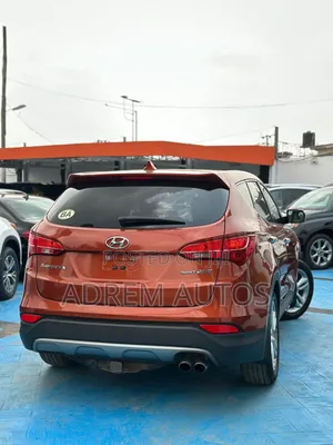 Hyundai Santa Fe Limited 4dr SUV AWD (3.3L 6cyl 6A) 2014 Orange