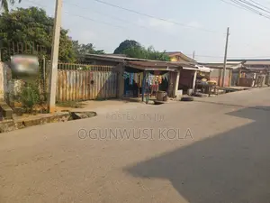 Land With 3 Shops for Sale