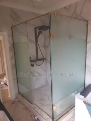 Glass Shower Cubicle With Gold Accessories