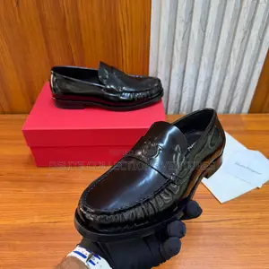 Luxury Update  Salvatore Ferragamo Embossed-Gancio Loafers.