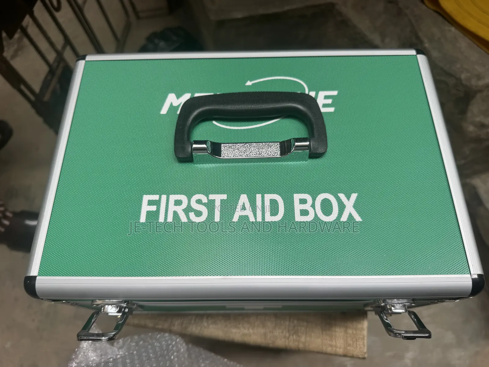 Medium-sized, Green, Aluminum First Aid Box.