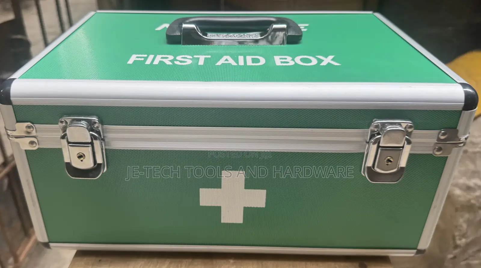 Medium-sized, Green, Aluminum First Aid Box.