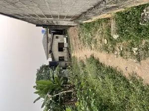 Half Plot of Land With 2 Bedroom Distress Building