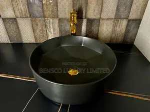 A Black Round Countertop Wash Had Basin