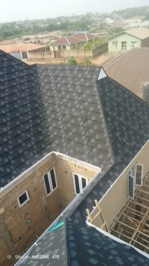Shingles and White PVC Gutter Installation