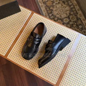 The Bold Cut-Out Bridge Loafers in Brown Black