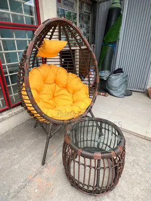 Quality Imported Unique Ratten Relaxing Chair and Side Stool