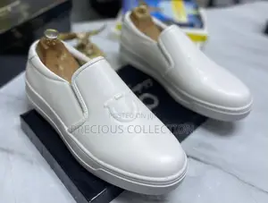 All White and Black Single Sole Pull on Ferragamo Shoe