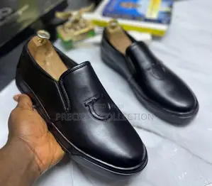 All White and Black Single Sole Pull on Ferragamo Shoe