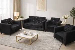 A Black 7 Seater Couch and Center Table