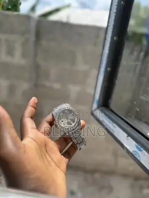 A Silver-Toned Iced-Out Diamond Wristwatch.