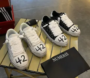New Numerics Studded Stained Canvas Sneakers