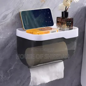 Wall Mounted Toilet Paper Dispenser With a Storage Shelf.