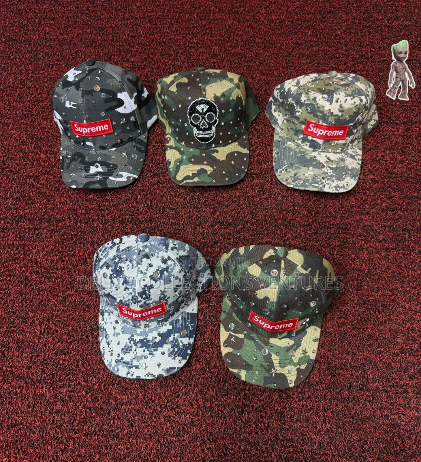 *Balenciaga the Simpsons Cap and *Supreme Stone Camo Cap* 