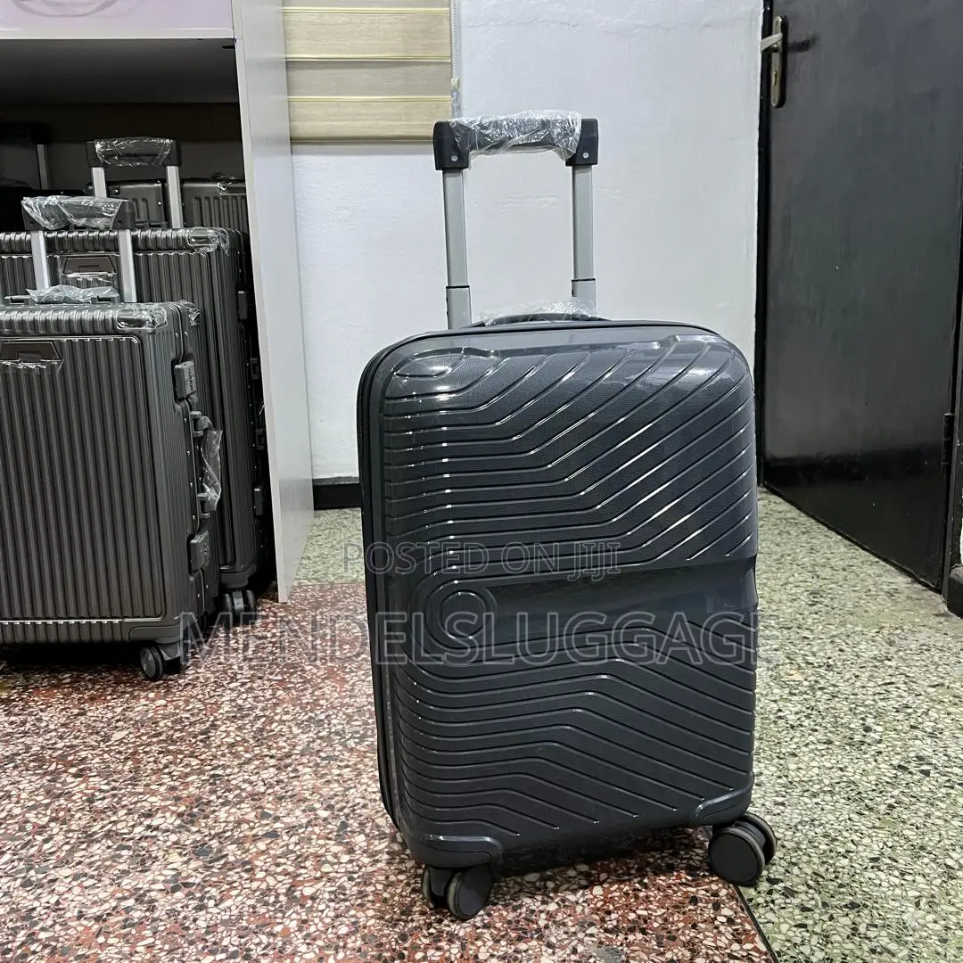 Dark Gray Hard-Shell Spinner Suitcase With Modern Design
