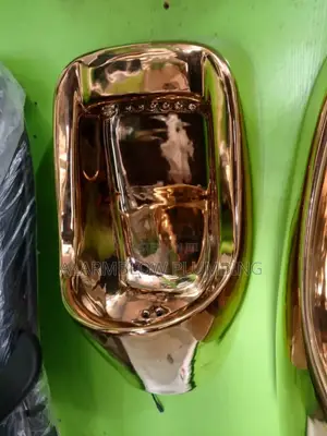Modern Wall-Mounted Gold Urinal Designed for Luxury Bathrooms.