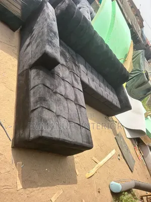 A Standard Black Velvet Seater Couch