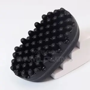 A Black Hairbrush Featuring A Twisted Afro Comb,