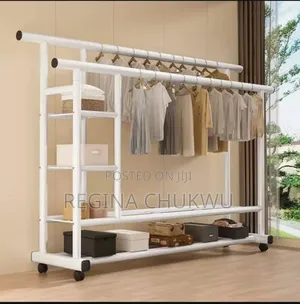 White Double Pole Cloth Rack With Storage Shelf