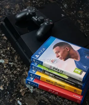 Ps4 With a Single Controller That Comes With 4 Cd Games