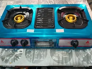 Akai Table Top Gas Cooker Featuring Two Burners and a Central Grill.
